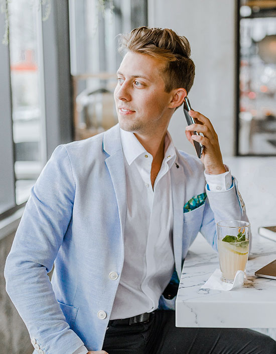 High-rise residential building under blue skies, showcasing modern architecture.